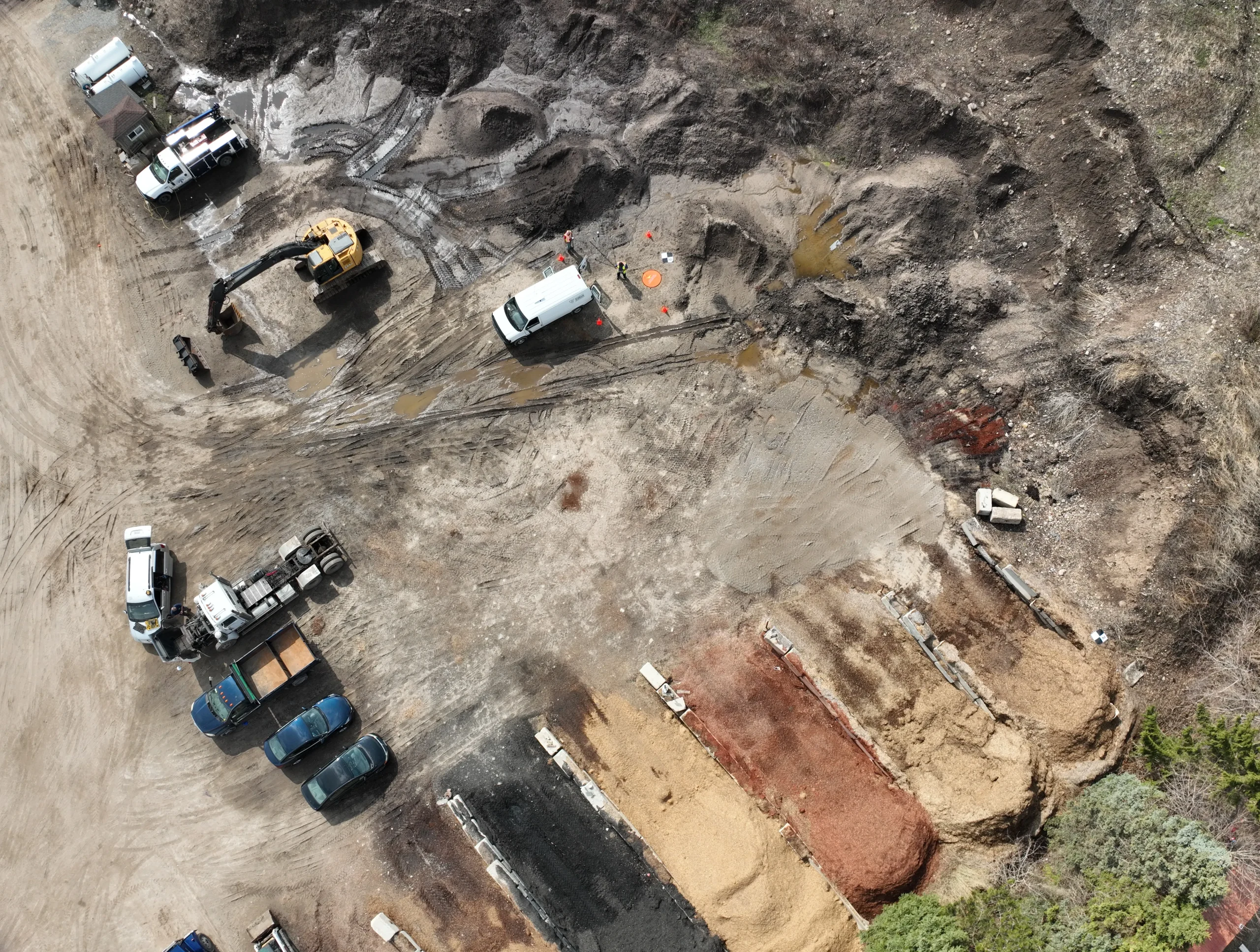 Top-down drone view of material stockpiles and excavation site for volumetric analysis in Ontario